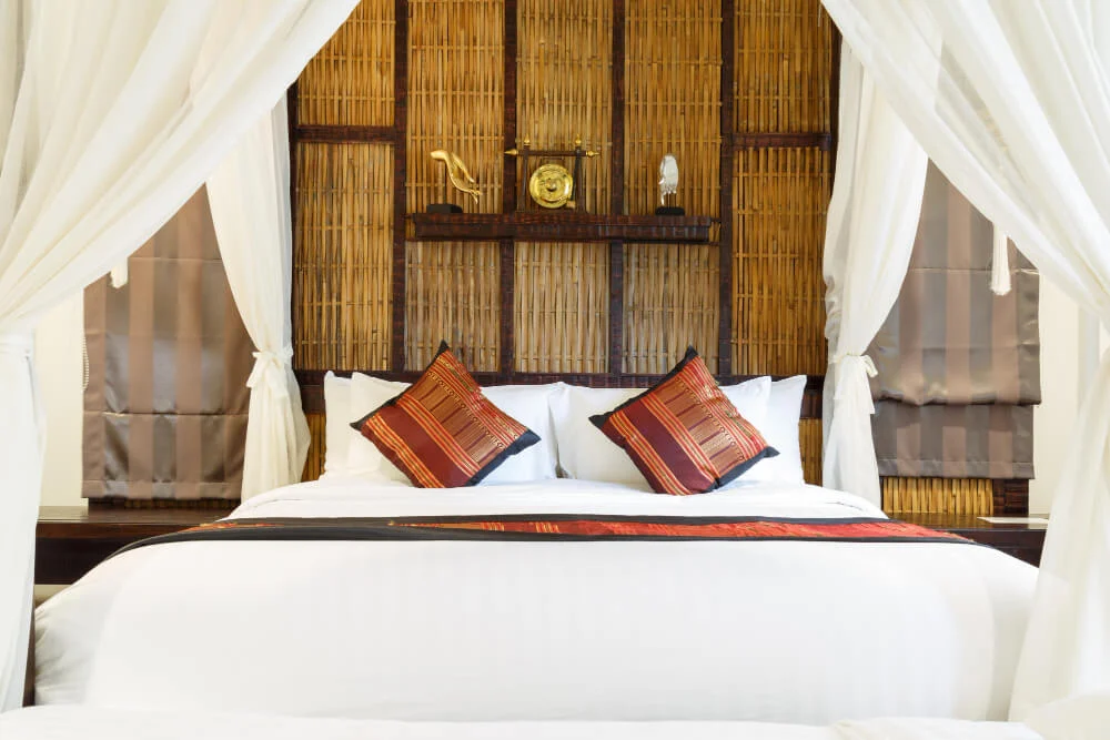 Luxury safari lodge bedroom in Serengeti with canopy bed and elegant decor